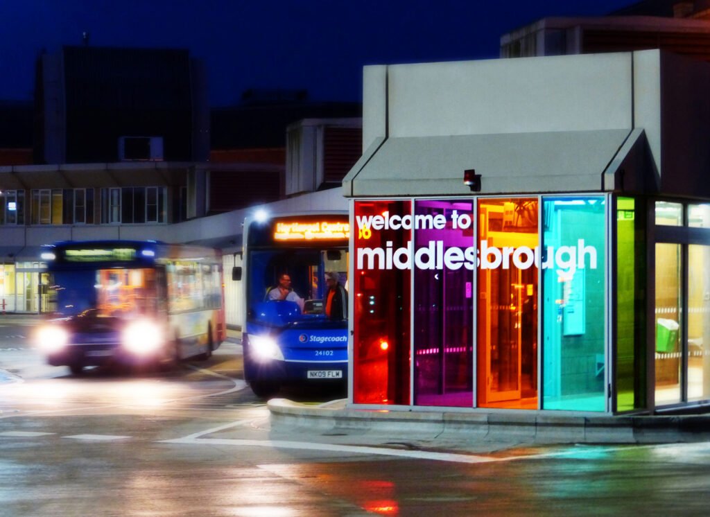 Middlesbrough bus station at night with fancy colours on the front