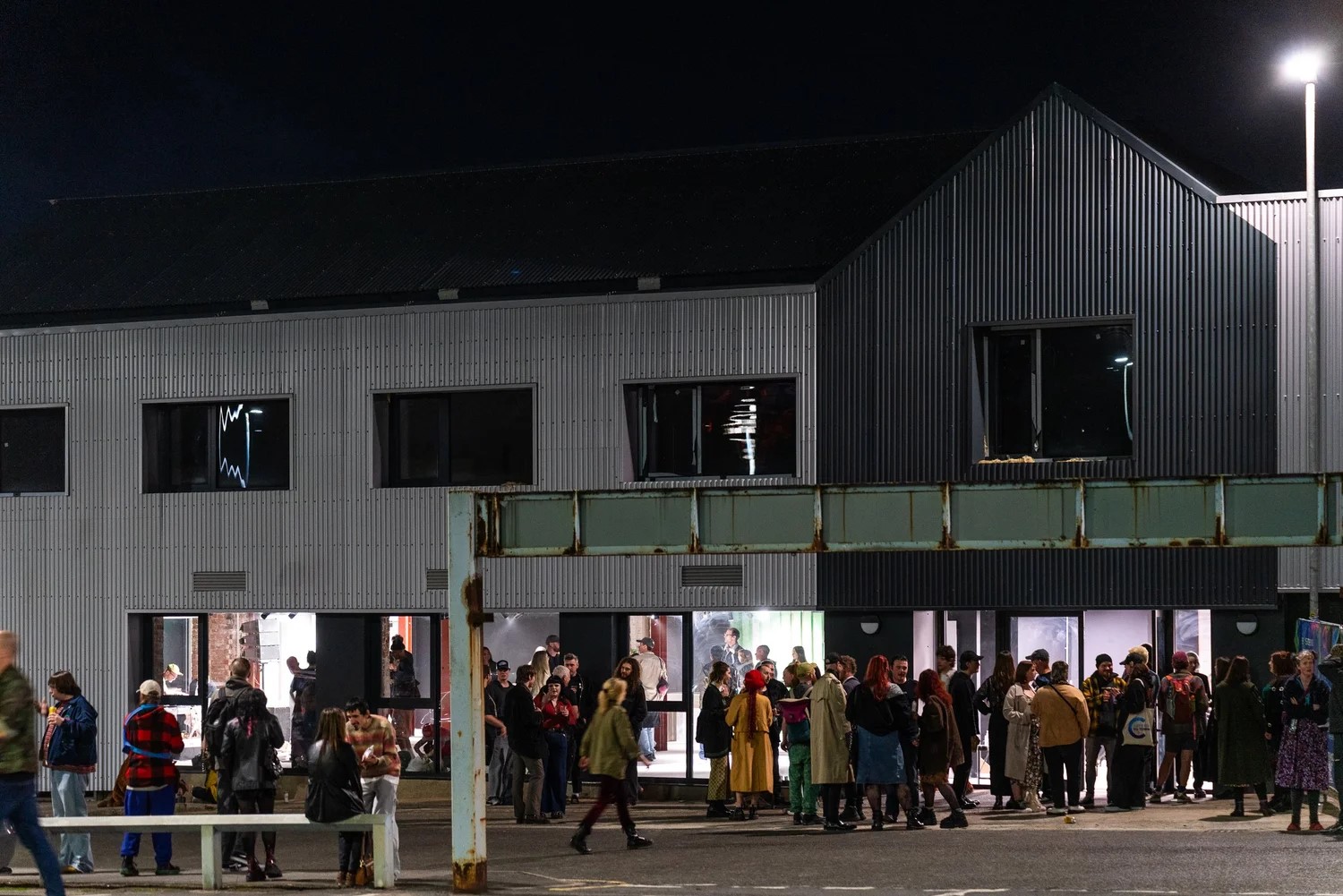 Exterior of the Auxiliary warehouse with crowds of people outside Exterior of the Auxiliary warehouse with crowds of people outside