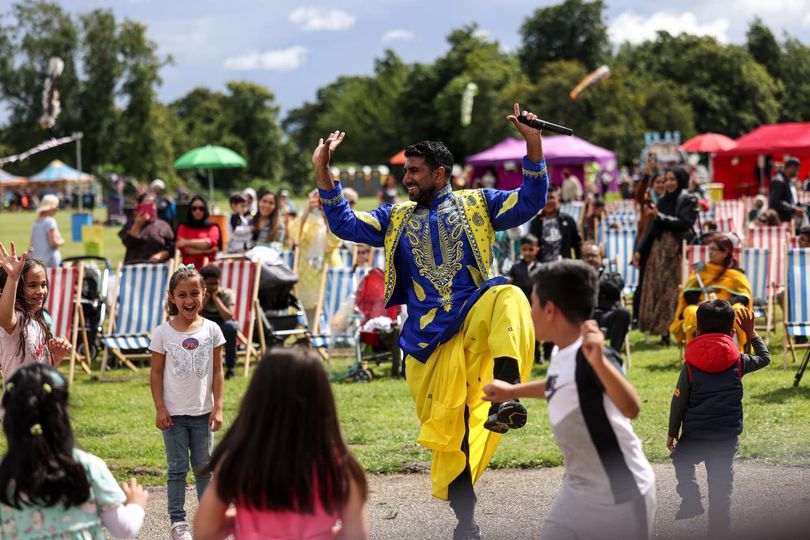 People dancing in colourful clothes at the Middlesbrough Mela