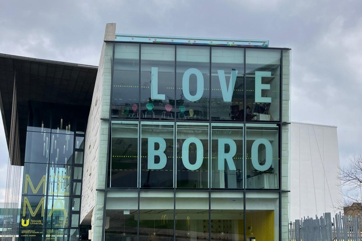 the words 'love boro' written in the window at MIMA