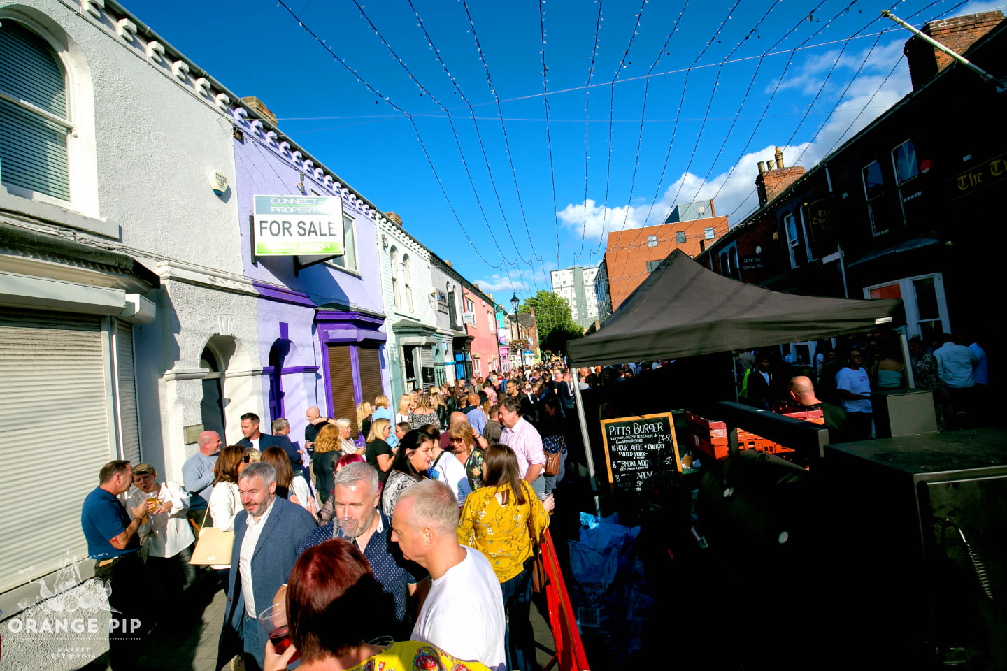 a sunny day on Baker Street filled with people for the Orange Pip market