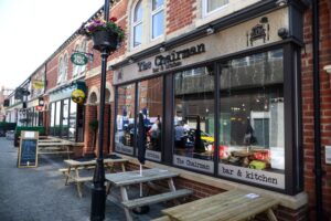 In front of the Chairman bar and kitchen on Bedford Street