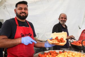 People serving street food at Middlesbrough Mela