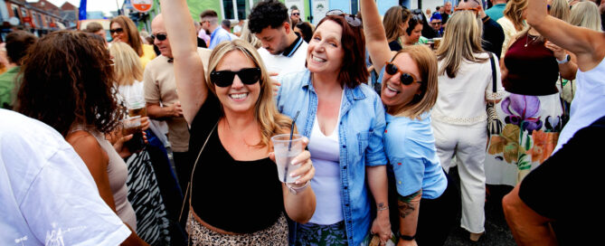 People enjoying the sun at May's Orange Pip 2026